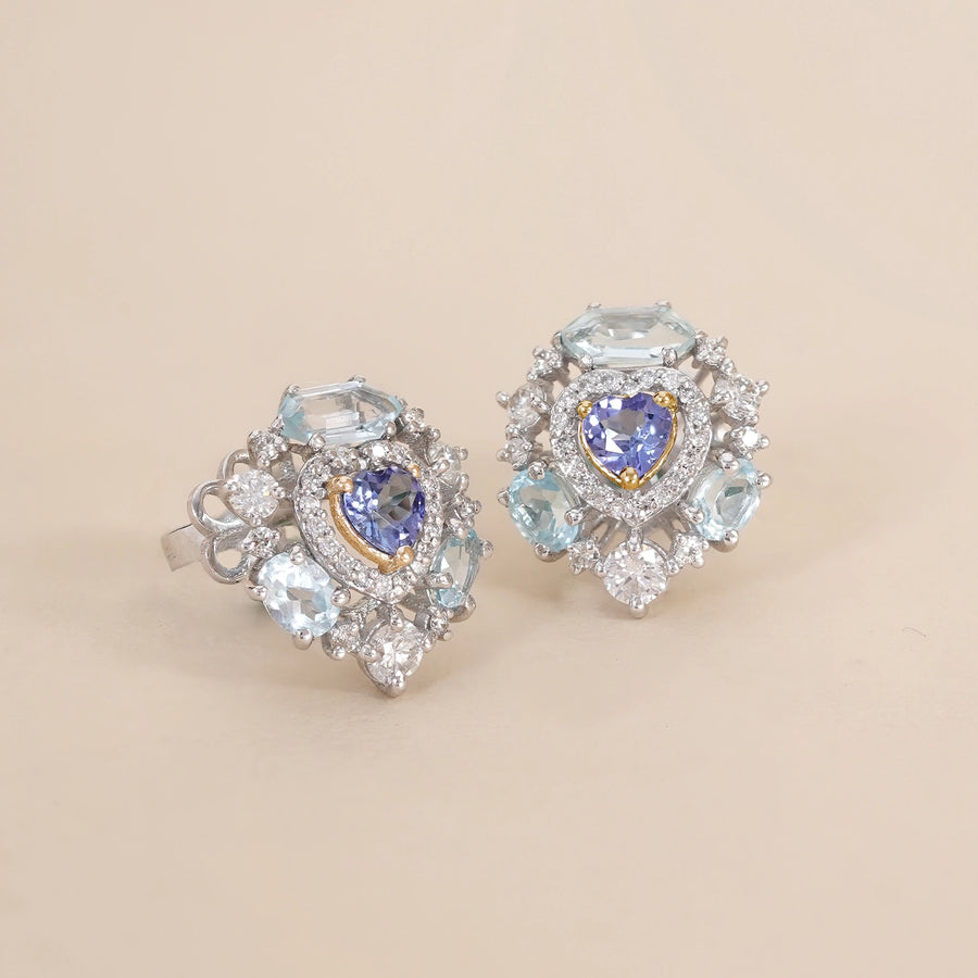 Amalfi Sky Studs with heart-shaped tanzanite surrounded by brilliant diamonds and blue topaz.