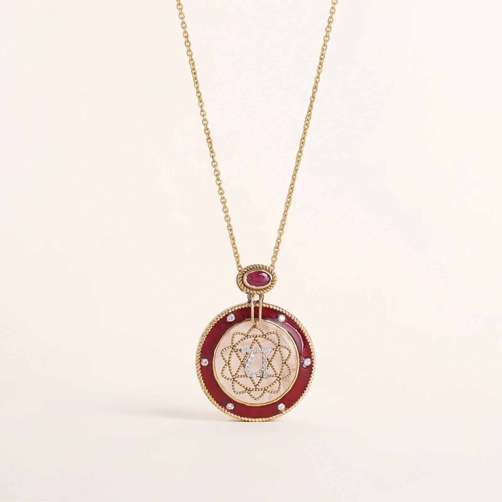 Anah Rose Pendant Necklace in 14K gold featuring rose quartz, diamond Anahata motif and red enamel.