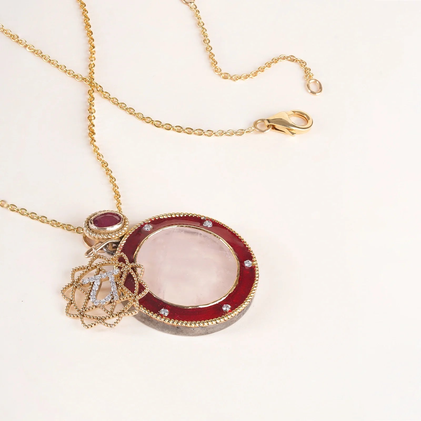 Anah Rose Pendant Necklace in 14K gold featuring rose quartz, diamond Anahata motif and red enamel.
