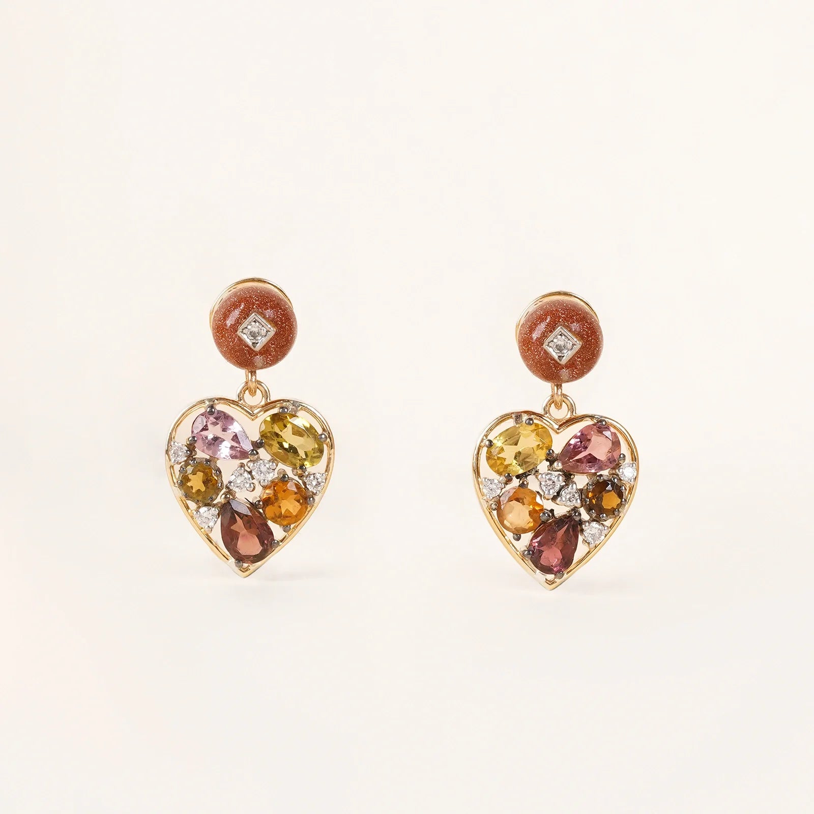 Bae Earrings in 14K gold with sunstone studs, multi-tourmaline heart drops and natural diamond accents.