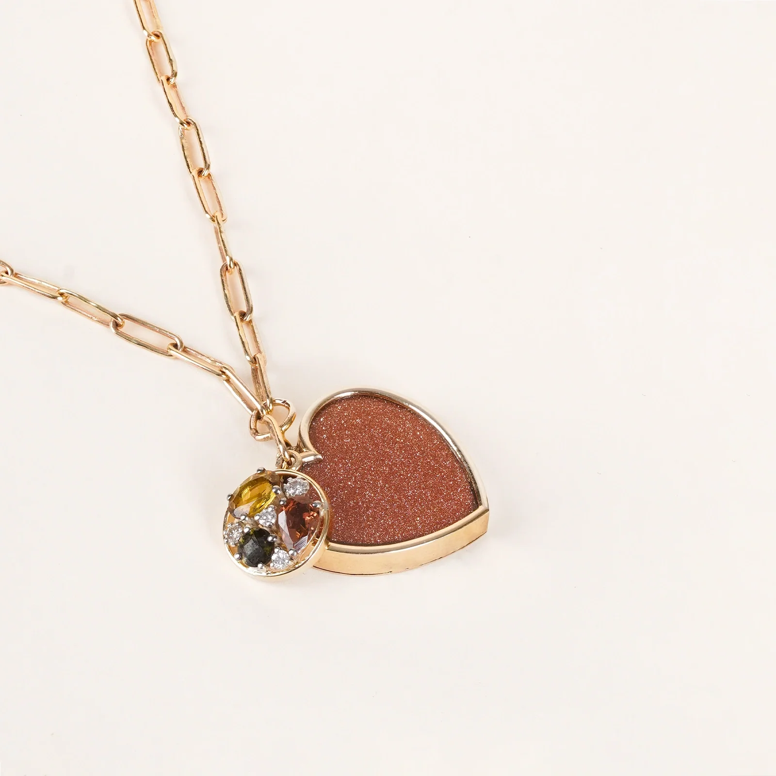 Belov Necklace in 14K gold with heart-shaped sunstone, tourmaline accents and natural diamond detailing.