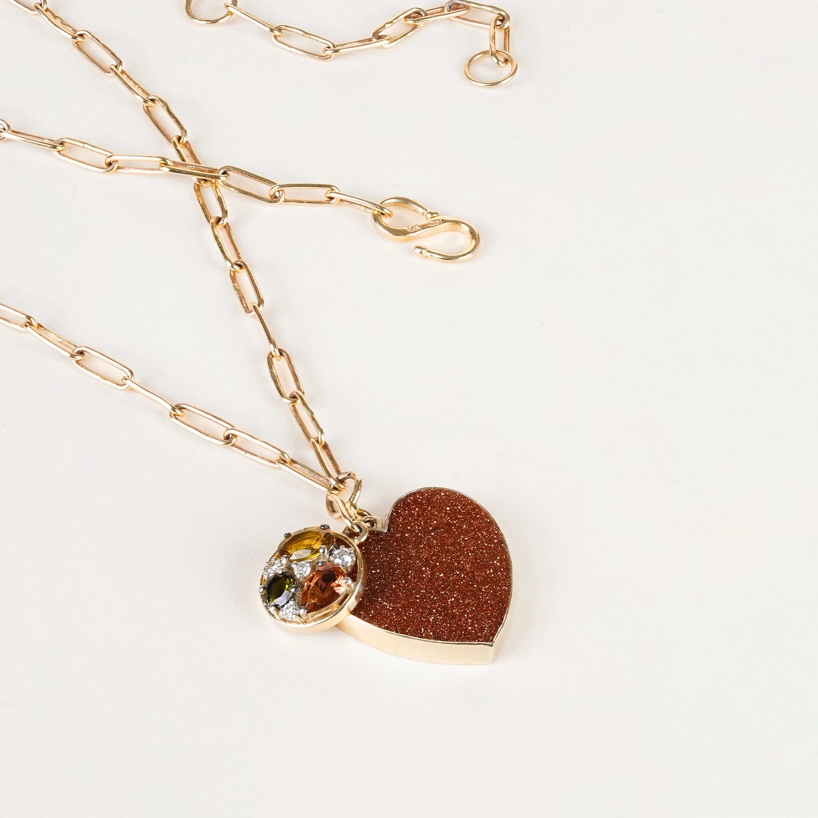 Belov Necklace in 14K gold with heart-shaped sunstone, tourmaline accents and natural diamond detailing.