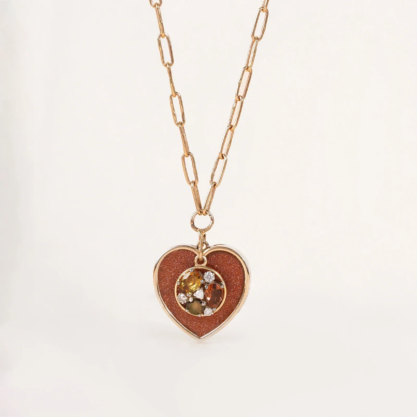Belov Necklace in 14K gold with heart-shaped sunstone, tourmaline accents and natural diamond detailing.