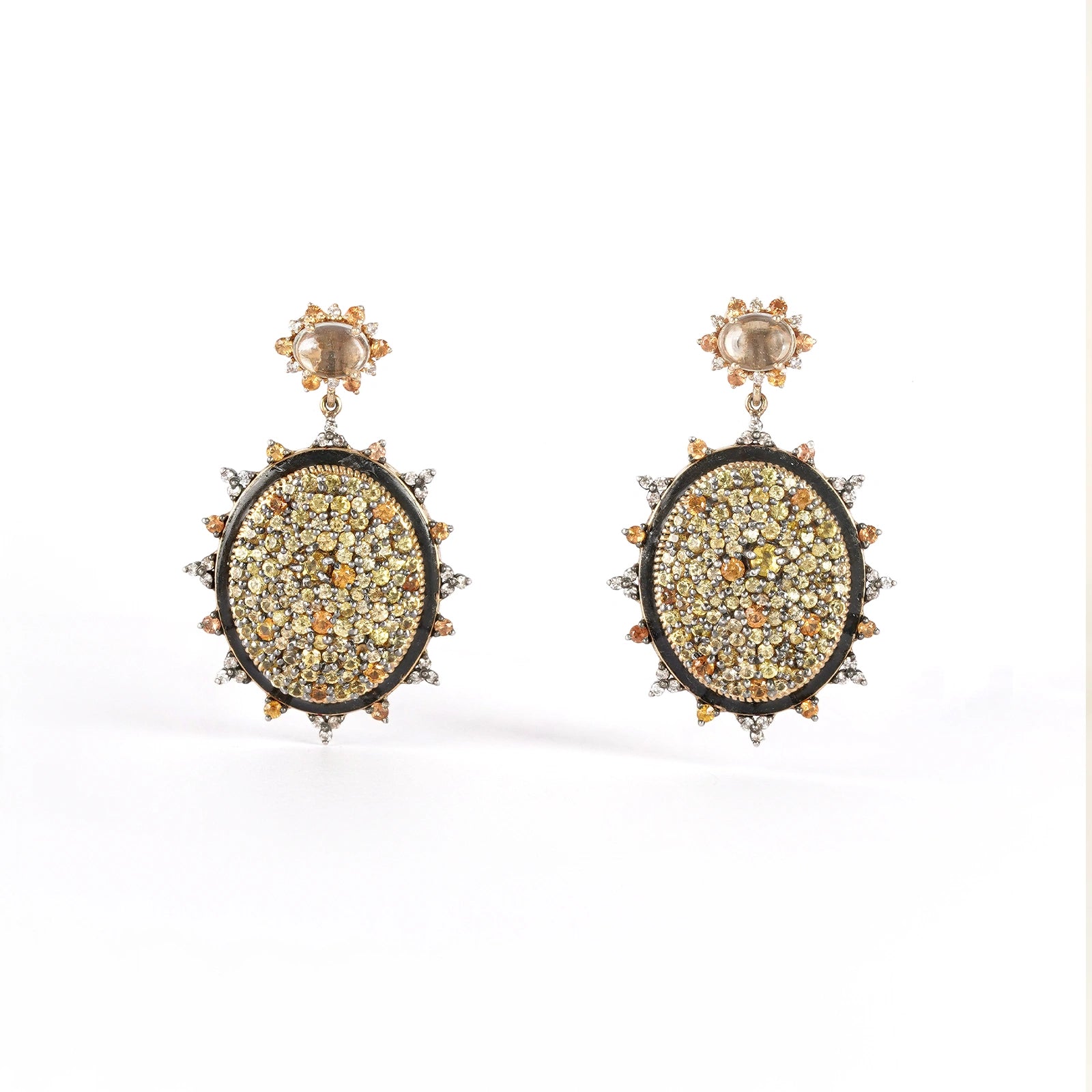 Sunburst earrings featuring pavé sapphires in warm, sun-kissed hues with faceted Green Amethyst stud tops.