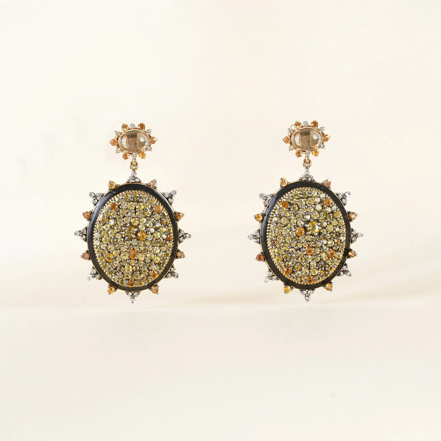 Sunburst earrings featuring pavé sapphires in warm, sun-kissed hues with faceted Green Amethyst stud tops.