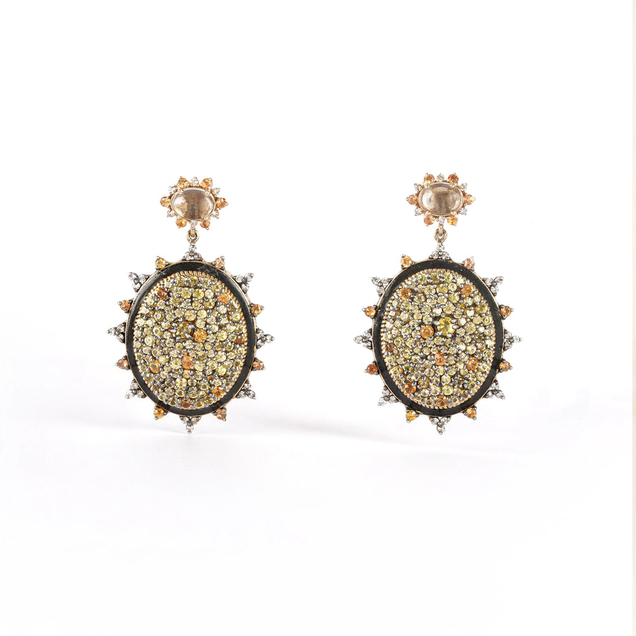 Sunburst earrings featuring pavé sapphires in warm, sun-kissed hues with faceted Green Amethyst stud tops.