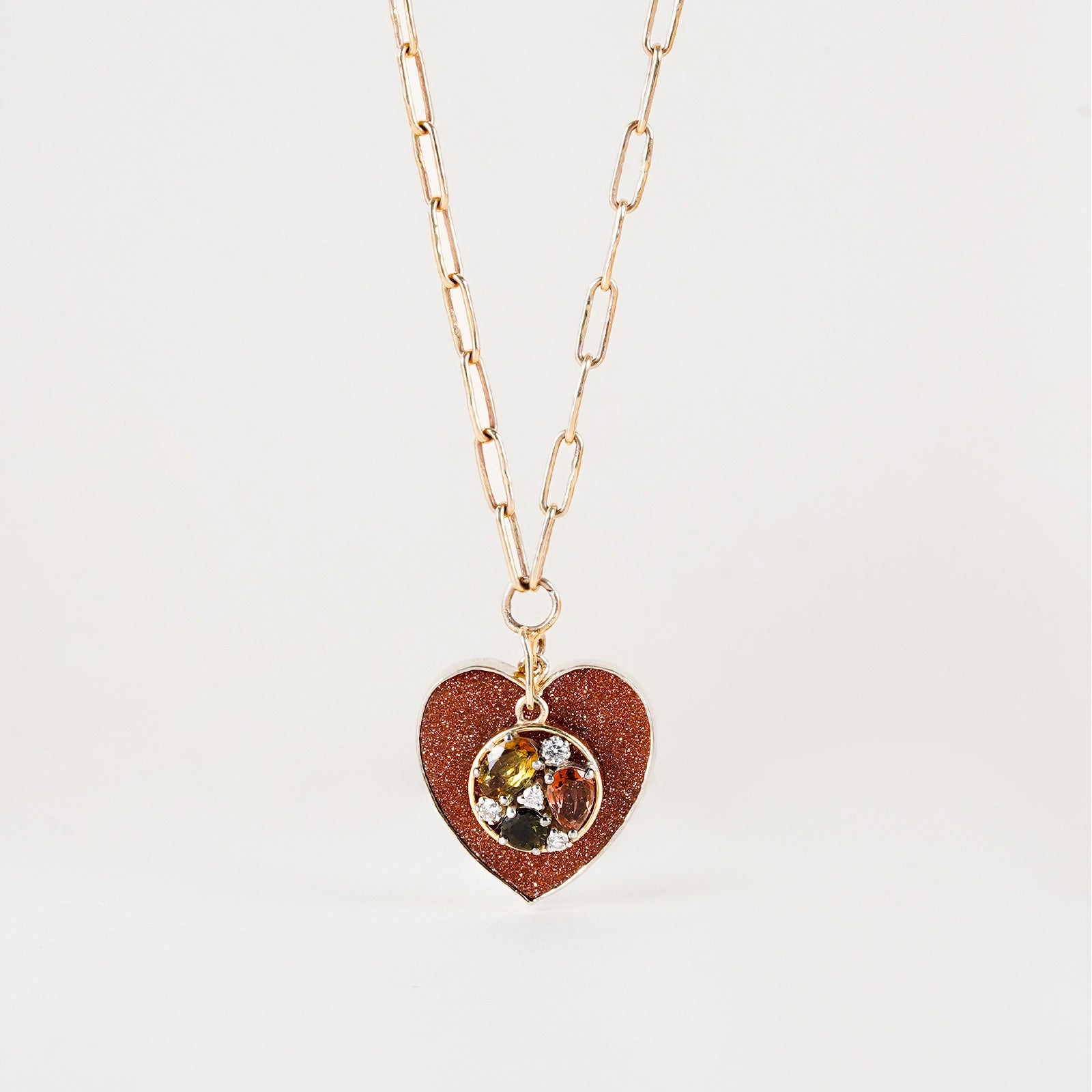 Belov Necklace in 14K gold with heart-shaped sunstone, tourmaline accents and natural diamond detailing.