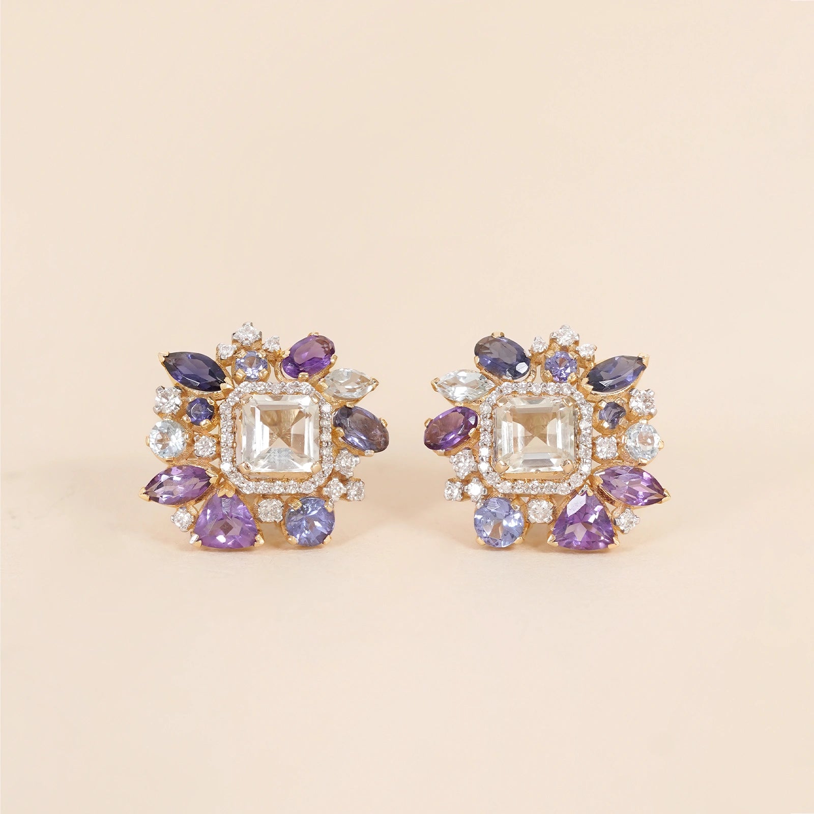 Gold Viola studs with green amethyst tanzanite and blue topaz gemstones.